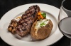Grilled New York Striploin  - Dry aged “AAA” striploin served with sautéed button mushrooms